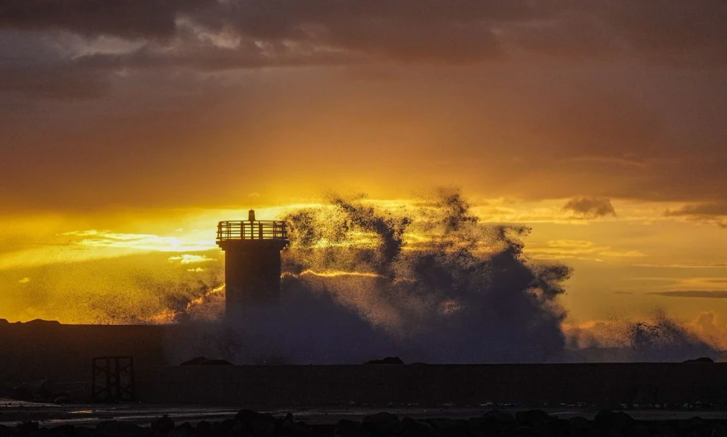 Silhouette at Sunset, from A Lighthouse Stands Where the Land Ends