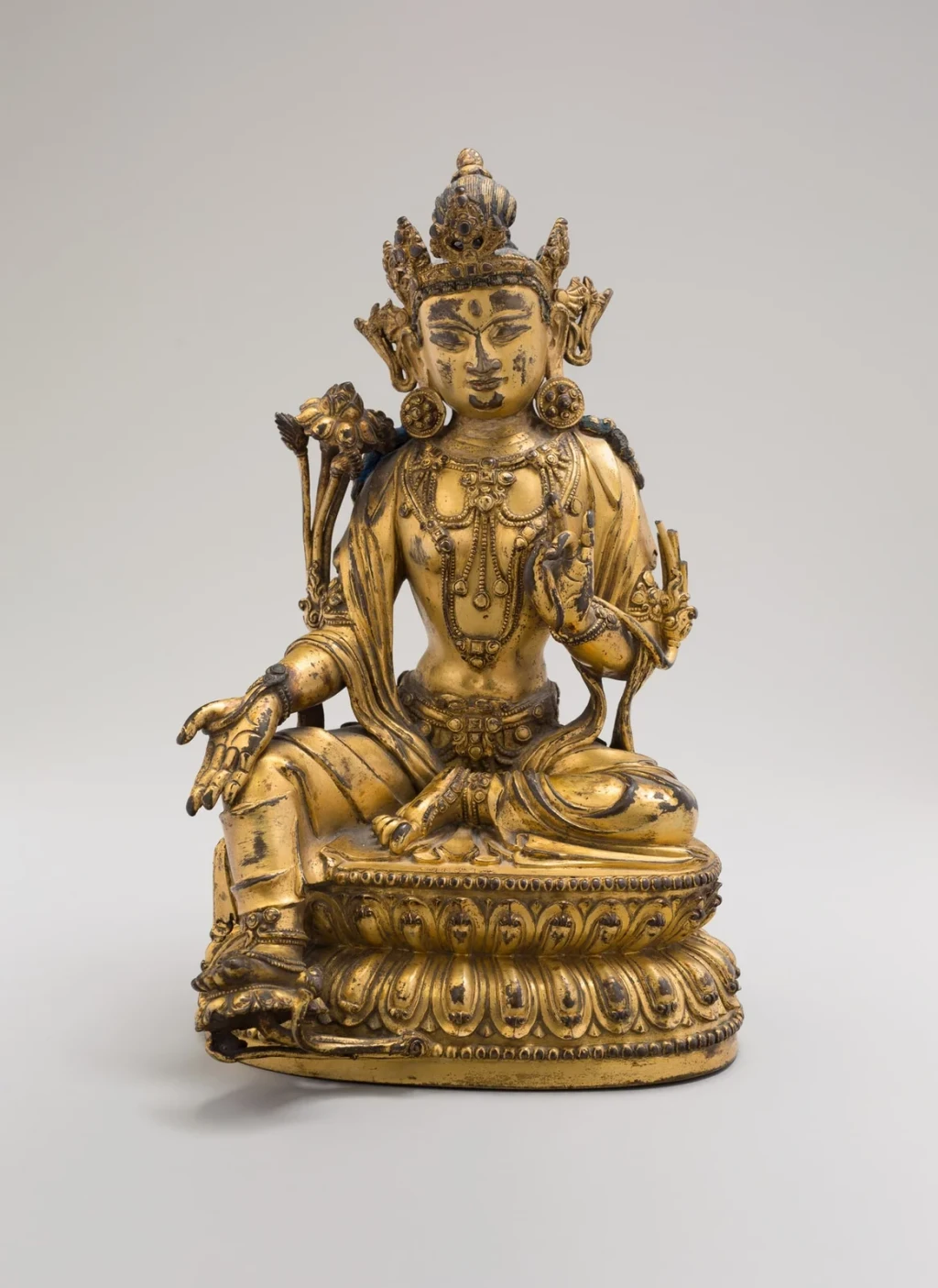 Green Tara, Seated in Pose of Royal Ease (Lalitasana), with Lotus Stalks on Right Shoulder and Hands in Gestures of Reasoning (Vitarkamudra) and Gift Conferring (Varadamudra), from Chinese Art
