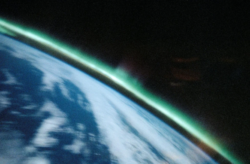 Aurora Australis, Spiked, Sinuous Green Airglow, from Earth From Above: A Very Thin Atmosphere