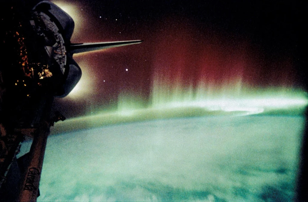 Aurora Australis, Spiked and Sinuous Red and Green Airglow, from Earth From Space